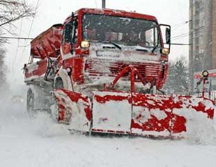 A vehicle clears the snow covering the roads in Dobrich, Bulgaria, on Jan. 3, 2008. As a bitterly cold winter storm gripped northeastern Bulgaria, cutting power to hundreds of towns and villages, blocking roads, authorities declared a state of emergency.  (Xinhua/Bulgarian News Agency)