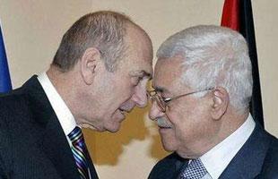 Israel's Prime Minister Ehud Olmert (L) speaks with Palestinian President Mahmoud Abbas during their meeting in Jerusalem Jan. 8, 2008. (Xinhua/Reuters Photo)