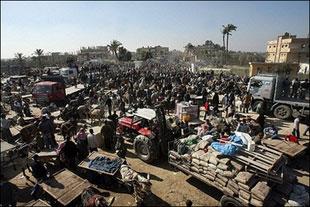 Palestinians cross into the Egyptian side of the border town of Rafah from the southern Gaza Strip. (AFP/Mahmud Hams) 