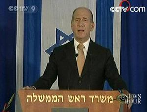 Israeli Prime Minister Ehud Olmert says the country will continue to build homes in the disputed Jerusalem neighborhood of Har Homa, rejecting international criticism of the project.