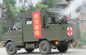 A vehicle sprays disinfectants in Longmenshan Township of quake-hit Pengzhou City, southwest China's Sichuan Province, May 22, 2008. The Ministry of Health and local Sichuan health agencies had dispatched 73,518 workers to conduct disease prevention work in quake-hit villages in Sichuan, and no major outbreak of epidemic diseases or other public health threats have so far been reported in quake-stricken areas. (Xinhua Photo)