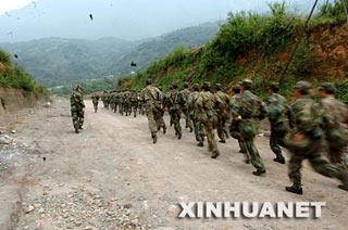 More than 12,000 troops and paramilitary personnel are now searching for the crash site.
