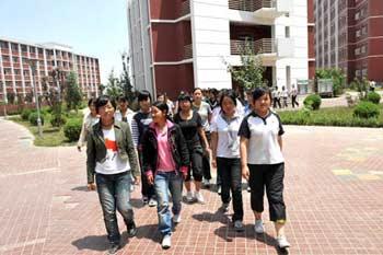 High school students from quake-affected Qingchuan of southwest China's Sichuan Province go to the dining-room after they arrive at Liupanshan Higher Middle School in Yinchuan, capital of northwest China's Ningxia Hui Autonomous Region, on June 12, 2008. A total of 130 high shool students from Qingchuan will continue their studies at Ningxia Liupanshan Higher Middle School. Their school tuitions and daily costs are covered by the government of Ningxia Hui Autonomous Region.(Xinhua Photo)