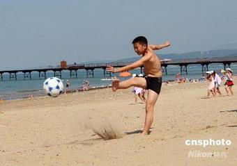 The children played soccer and made sandcastles.