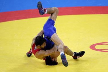Namig&nbsp;Sevdimov&nbsp;(red)&nbsp;competes&nbsp;against&nbsp;Henry&nbsp;Cejudo.