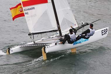 (L-R) Fernando Echavarri and Anton Paz of Spain fly their national flag.