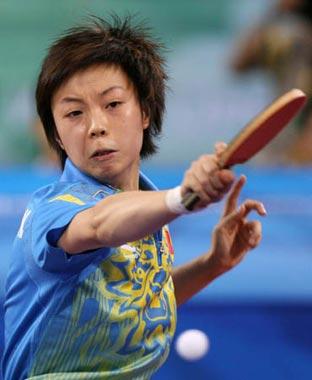 Zhang Yining of China returns the ball during the women's singles gold medal match of Beijing Olympic Games table tennis event against her compatriot Wang Nan in Beijing, China, Aug. 22, 2008. Zhang Yining won the match and grabbed the gold medal. (Xinhua/Bao Feifei)