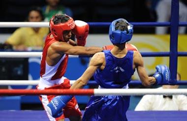 Somjit&nbsp;Jongjohor(blue)&nbsp;of&nbsp;Thailand&nbsp;competes&nbsp;during&nbsp;Men's&nbsp;Fly&nbsp;(51kg)&nbsp;Final&nbsp;Bout&nbsp;between&nbsp;Andris&nbsp;Laffita&nbsp;Hernandez&nbsp;of&nbsp;Cuba&nbsp;and&nbsp;Somjit&nbsp;Jongjohor&nbsp;of&nbsp;Thailand&nbsp;of&nbsp;Beijing&nbsp;2008&nbsp;Olympic&nbsp;Games&nbsp;boxing&nbsp;event&nbsp;at&nbsp;Workers'&nbsp;Gymnasium&nbsp;in&nbsp;Beijing,&nbsp;China,&nbsp;Aug.&nbsp;23,&nbsp;2008.&nbsp;Somjit&nbsp;Jongjohor&nbsp;defeated&nbsp;Andris&nbsp;Laffita&nbsp;Hernandez&nbsp;8-2,&nbsp;and&nbsp;won&nbsp;the&nbsp;gold&nbsp;medal&nbsp;of&nbsp;the&nbsp;event.&nbsp;(Xinhua&nbsp;Photo)