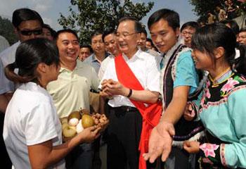 Chinese Premier Wen Jiabao visits Qiang ethnic group village in Beichuan County, southwest China's Sichuan Province, Sept. 1, 2008. Wen inspected repair work and raised morale among residents over the past three days, during a visit to southwestern Sichuan Province nearly four months after the devastating May 12 earthquake. (Xinhua Photo) 