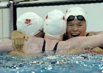 Valerie&nbsp;Maison&nbsp;Grand&nbsp;(R)&nbsp;of&nbsp;Canada&nbsp;celebrates&nbsp;with&nbsp;teammates&nbsp;Chelsey&nbsp;Gitell&nbsp;(C)&nbsp;and&nbsp;Cote&nbsp;Kirby&nbsp;(L)&nbsp;after&nbsp;winning&nbsp;the&nbsp;gold&nbsp;medal&nbsp;in&nbsp;the&nbsp;women's&nbsp;100m&nbsp;butterfly&nbsp;S13&nbsp;final&nbsp;during&nbsp;the&nbsp;2008&nbsp;Beijing&nbsp;Paralympic&nbsp;Games&nbsp;at&nbsp;the&nbsp;National&nbsp;Aquatic&nbsp;Center&nbsp;also&nbsp;known&nbsp;as&nbsp;the&nbsp;water&nbsp;cube&nbsp;in&nbsp;Beijing,&nbsp;September&nbsp;7,&nbsp;2008.&nbsp;
