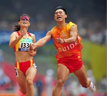 China's&nbsp;Wu&nbsp;Chunmiao&nbsp;(L)&nbsp;runs&nbsp;with&nbsp;the&nbsp;guide&nbsp;during&nbsp;the&nbsp;final&nbsp;of&nbsp;the&nbsp;women's&nbsp;100m&nbsp;T11&nbsp;of&nbsp;the&nbsp;Beijing&nbsp;2008&nbsp;Paralympic&nbsp;Games,&nbsp;at&nbsp;the&nbsp;National&nbsp;Stadium,&nbsp;also&nbsp;known&nbsp;as&nbsp;the&nbsp;Bird's&nbsp;Nest,&nbsp;in&nbsp;Beijing,&nbsp;China,&nbsp;Sept.&nbsp;9,&nbsp;2008.&nbsp;Wu&nbsp;claimed&nbsp;the&nbsp;title&nbsp;of&nbsp;the&nbsp;event&nbsp;with&nbsp;a&nbsp;time&nbsp;of&nbsp;12.31&nbsp;seconds.(Xinhua&nbsp;Photo)