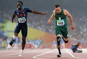 "Blade&nbsp;Runner"&nbsp;Oscar&nbsp;Pistorius&nbsp;(R)&nbsp;from&nbsp;South&nbsp;Africa&nbsp;crosses&nbsp;the&nbsp;finish&nbsp;line&nbsp;ahead&nbsp;of&nbsp;Jerome&nbsp;Singleton&nbsp;of&nbsp;the&nbsp;United&nbsp;States&nbsp;during&nbsp;the&nbsp;final&nbsp;of&nbsp;men's&nbsp;100m&nbsp;T44&nbsp;of&nbsp;the&nbsp;Beijing&nbsp;2008&nbsp;Paralympic&nbsp;Games,&nbsp;at&nbsp;the&nbsp;National&nbsp;Stadium,&nbsp;also&nbsp;known&nbsp;as&nbsp;the&nbsp;Bird's&nbsp;Nest,&nbsp;in&nbsp;Beijing,&nbsp;China,&nbsp;Sept.&nbsp;9,&nbsp;2008.&nbsp;Pistorius&nbsp;claimed&nbsp;the&nbsp;title&nbsp;of&nbsp;the&nbsp;event&nbsp;with&nbsp;a&nbsp;time&nbsp;of&nbsp;11.17&nbsp;seconds.(Xinhua/Li&nbsp;Ga)
