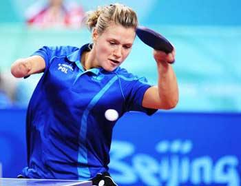 Natalia&nbsp;Partyka&nbsp;of&nbsp;Poland&nbsp;returns&nbsp;the&nbsp;ball&nbsp;during&nbsp;a&nbsp;semifinal&nbsp;of&nbsp;women's&nbsp;individual&nbsp;(Class&nbsp;F10)&nbsp;against&nbsp;Michala&nbsp;la&nbsp;Bourdonnaye&nbsp;of&nbsp;Czech&nbsp;at&nbsp;the&nbsp;Beijing&nbsp;2008&nbsp;Paralympic&nbsp;Games&nbsp;table&nbsp;tennis&nbsp;event&nbsp;on&nbsp;Sept.&nbsp;10,&nbsp;2008.&nbsp;Partyka&nbsp;won&nbsp;3-0&nbsp;and&nbsp;advanced&nbsp;to&nbsp;the&nbsp;final.&nbsp;The&nbsp;19-year-old&nbsp;Polish&nbsp;player,&nbsp;who&nbsp;was&nbsp;born&nbsp;with&nbsp;a&nbsp;right&nbsp;arm&nbsp;that&nbsp;ends&nbsp;at&nbsp;the&nbsp;elbow,&nbsp;is&nbsp;the&nbsp;Paralympic&nbsp;champion&nbsp;in&nbsp;Athen&nbsp;2004.&nbsp;Before&nbsp;defending&nbsp;her&nbsp;Paralympic&nbsp;title,&nbsp;she&nbsp;played&nbsp;in&nbsp;the&nbsp;table&nbsp;tennis&nbsp;team&nbsp;event&nbsp;at&nbsp;Beijing&nbsp;2008&nbsp;Olympic&nbsp;Games,&nbsp;which&nbsp;made&nbsp;her&nbsp;one&nbsp;of&nbsp;only&nbsp;two&nbsp;athletes,&nbsp;along&nbsp;with&nbsp;South&nbsp;African&nbsp;swimmer&nbsp;Natalie&nbsp;du&nbsp;Toit,&nbsp;to&nbsp;compete&nbsp;in&nbsp;both&nbsp;Olympic&nbsp;and&nbsp;Paralympic&nbsp;in&nbsp;Beijing.(Xinhua&nbsp;Photo)