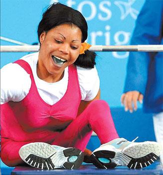 Nigerian&nbsp;powerlifter&nbsp;Lucy&nbsp;Ejike&nbsp;smiles&nbsp;after&nbsp;breaking&nbsp;the&nbsp;world&nbsp;record&nbsp;of&nbsp;130kg&nbsp;to&nbsp;win&nbsp;the&nbsp;gold.