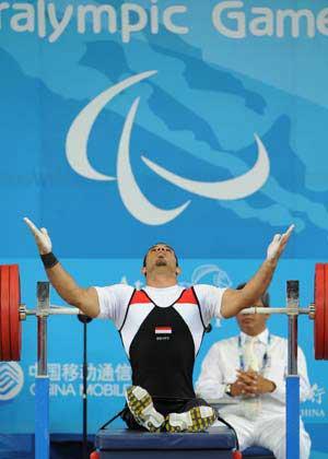 Sherif&nbsp;Othman&nbsp;Othman&nbsp;of&nbsp;Egypt&nbsp;reacts&nbsp;during&nbsp;the&nbsp;men's&nbsp;56kg&nbsp;final&nbsp;at&nbsp;the&nbsp;Beijing&nbsp;2008&nbsp;Paralympic&nbsp;Games&nbsp;Powerlifting&nbsp;event&nbsp;in&nbsp;Beijing,&nbsp;Sept.&nbsp;11,&nbsp;2008.&nbsp;Othman&nbsp;broke&nbsp;the&nbsp;world&nbsp;record&nbsp;and&nbsp;claimed&nbsp;the&nbsp;title&nbsp;with&nbsp;202.5kg.&nbsp;(Xinhua&nbsp;Photo)
