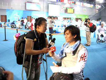 Chinese&nbsp;wheelchair&nbsp;fencer&nbsp;Jin&nbsp;Jing(L)&nbsp;makes&nbsp;an&nbsp;interview&nbsp;with&nbsp;Chan&nbsp;Wing&nbsp;Kin&nbsp;of&nbsp;Chinese&nbsp;Hong&nbsp;Kong&nbsp;after&nbsp;men's&nbsp;individual&nbsp;foil&nbsp;preliminary&nbsp;match&nbsp;of&nbsp;the&nbsp;Beijing&nbsp;2008&nbsp;Paralympic&nbsp;Games&nbsp;wheelchair&nbsp;fencing&nbsp;event&nbsp;in&nbsp;Beijing,&nbsp;China,&nbsp;September&nbsp;14,&nbsp;2008.&nbsp;(Xinhua/Zhang&nbsp;Lei)