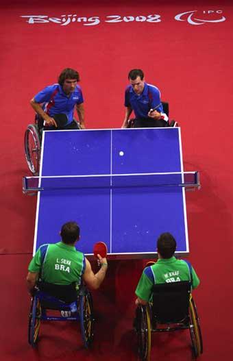 Jean-Phillippe&nbsp;Robin&nbsp;(blue,&nbsp;R2)&nbsp;serves.&nbsp;Jean-Philippe&nbsp;Robin&nbsp;and&nbsp;Florian&nbsp;Merrien&nbsp;of&nbsp;France&nbsp;beat&nbsp;Luiz&nbsp;Algacir&nbsp;Silva&nbsp;and&nbsp;Welder&nbsp;Knaf&nbsp;of&nbsp;Brazil&nbsp;3-1&nbsp;in&nbsp;the&nbsp;Men's&nbsp;Table&nbsp;Tennis&nbsp;Team&nbsp;Class&nbsp;3&nbsp;final&nbsp;at&nbsp;the&nbsp;Beijing&nbsp;2008&nbsp;Paralympic&nbsp;Games&nbsp;on&nbsp;September&nbsp;15,&nbsp;2008,&nbsp;claiming&nbsp;the&nbsp;gold&nbsp;medal.&nbsp;[Getty&nbsp;Images]