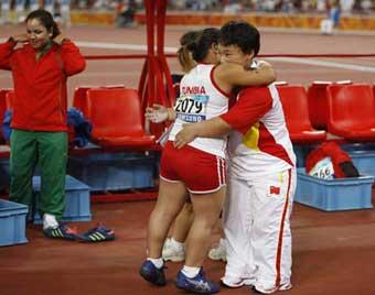 Tunisia's&nbsp;Raoua&nbsp;Tlili&nbsp;and&nbsp;China's&nbsp;Menggen&nbsp;Jimisu&nbsp;(R)&nbsp;congratulate&nbsp;each&nbsp;other&nbsp;after&nbsp;women's&nbsp;shot&nbsp;put&nbsp;F40&nbsp;final&nbsp;at&nbsp;the&nbsp;National&nbsp;Stadium，also&nbsp;known&nbsp;as&nbsp;the&nbsp;Bird's&nbsp;Nest，during&nbsp;the&nbsp;Beijing&nbsp;2008&nbsp;Paralympic&nbsp;Games&nbsp;in&nbsp;Beijing,&nbsp;Sept.&nbsp;15,&nbsp;2008.&nbsp;Tlili&nbsp;won&nbsp;the&nbsp;gold&nbsp;medal&nbsp;with&nbsp;8.95&nbsp;meters.&nbsp;Menggen&nbsp;Jimisu&nbsp;won&nbsp;the&nbsp;silver&nbsp;medal.(Xinhua&nbsp;Photo)