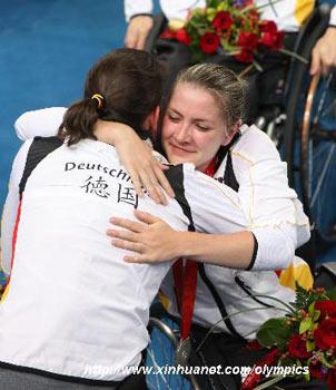 Player&nbsp;of&nbsp;the&nbsp;Germany&nbsp;hugs&nbsp;teammate&nbsp;in&nbsp;the&nbsp;awarding&nbsp;ceremony&nbsp;of&nbsp;women's&nbsp;wheelchair&nbsp;basketball&nbsp;at&nbsp;the&nbsp;Beijing&nbsp;2008&nbsp;Paralympic&nbsp;Games&nbsp;in&nbsp;Beijing,&nbsp;September&nbsp;15,&nbsp;2008.&nbsp;Germany&nbsp;was&nbsp;defeated&nbsp;by&nbsp;USA&nbsp;38-50&nbsp;and&nbsp;won&nbsp;the&nbsp;silver&nbsp;medal.&nbsp;(Xinhua/Meng&nbsp;Yongmin)