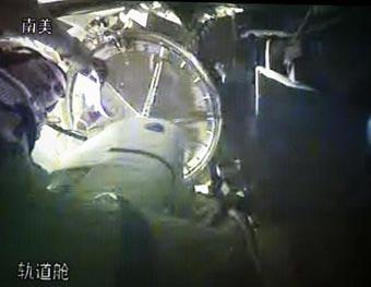 The video grab taken on Sept. 27, 2008 at the Beijing Space Command and Control Center in Beijing, China, shows Chinese taikonaut Zhai Zhigang prepares for the spacewalk at the orbital module in Shenzhou-7. Chinese taikonauts began the activities of China's first spacewalk on Saturday afternoon. (Xinhua/Zha Chunming)