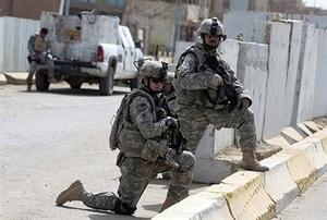 US soldiers scan a street in the former restive district of Dora in south eastern Baghdad in September 2008.(AFP/File/Ahmad al-Rubaye)