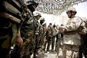 US military chief Michael Mullen bluntly, seen here addressing Iraqi troops in Mosul in July, has warned Iraq it risked security losses of "significant consequence" unless it approves an agreement on a legal basis for US forces there.(AFP/HO/File/Chad J. Mcneeley)