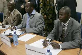 Eastern Congo rebel delegates Abadi Rene (L), Bisimwa Bertrand (C) and Mbonimpa Benjamin (R) listen in during the official opening of peace talks between the Congolese government and the eastern Congolese rebel group of General Laurent Nkunda at the U.N. headquarters in Nairobi December 8, 2008.REUTERS/Antony Njuguna