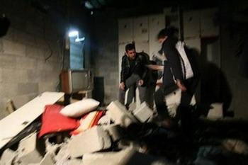 A Palestinian men inspect a destroyed house in the Jabalia refugee camp northern of Gaza Strip, on December 17. Israeli warplanes conducted two more nighttime air strikes against the Gaza Strip following rocket fire against Israel, according to witnesses.(AFP/Mohammed Abed)