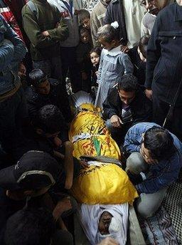 Palestinians mourn over the body of Ali Hijazi during his funeral at the Jabaliya refugee camp in the northern Gaza Strip. One Palestinian gunman was killed and three people were wounded by an Israeli air strike in the Hamas-ruled Gaza Strip on Saturday as rocket and mortar fire from the territory hit southern Israel.(AFP/Mahmud Hams)