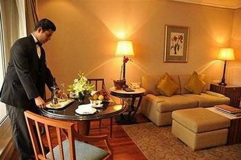 In this handout picture from the Taj Mahal Hotel, a member of staff prepares a suite. Final preparations were under way Saturday in Mumbai for the re-opening of the two luxury hotels recently stormed by Islamist militants, amid tight security and pledges to return to business as usual.(AFP/HO Taj Mahal Hotel/Ho)