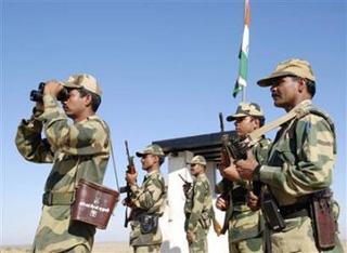 Border Security Force (BSF) soldiers patrol the border at the India-Pakistan International Border Post, about 180 km (112 miles) from the western Indian city of Bikaner December 25, 2008. (Vinay Joshi/Reuters)