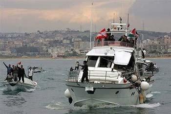 An Israeli naval vessel collided on Tuesday with a boat carrying activists and medical supplies that was trying to break the blockade of Gaza,forcing it to divert to a port in Lebanon.(AFP/Mahmoud Zayat)
