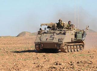 An&nbsp;Israeli&nbsp;armored&nbsp;personnel&nbsp;vehicle&nbsp;march&nbsp;towards&nbsp;the&nbsp;south&nbsp;of&nbsp;the&nbsp;Gaza&nbsp;Strip,&nbsp;Jan.&nbsp;6,&nbsp;2009.&nbsp;Over&nbsp;540&nbsp;Palestinians&nbsp;have&nbsp;been&nbsp;killed&nbsp;and&nbsp;some&nbsp;2,500&nbsp;others&nbsp;injured&nbsp;in&nbsp;the&nbsp;Gaza&nbsp;Strip&nbsp;during&nbsp;Israel's&nbsp;Operation&nbsp;Cast&nbsp;Lead&nbsp;starting&nbsp;from&nbsp;Dec.&nbsp;27,&nbsp;2008.&nbsp;(Xinhua/Yin&nbsp;Bogu)