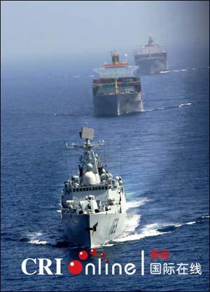 The Chinese Navy fleet completed its first escort mission off the coast of Somalia on Thursday, accompanying four cargo ships sailing through the Gulf of Aden.