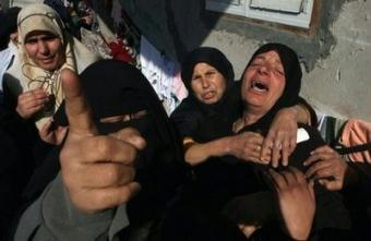Palestinian&nbsp;relatives&nbsp;of&nbsp;a&nbsp;Hamas&nbsp;fighter&nbsp;mourn&nbsp;after&nbsp;he&nbsp;was&nbsp;killed&nbsp;by&nbsp;an&nbsp;Israeli&nbsp;air&nbsp;strike.&nbsp;World&nbsp;leaders&nbsp;expressed&nbsp;mounting&nbsp;concern&nbsp;about&nbsp;the&nbsp;humanitarian&nbsp;impact&nbsp;of&nbsp;Israel's&nbsp;massive&nbsp;offensive&nbsp;on&nbsp;the&nbsp;Gaza&nbsp;Strip,&nbsp;as&nbsp;diplomatic&nbsp;efforts&nbsp;to&nbsp;bring&nbsp;an&nbsp;end&nbsp;to&nbsp;the&nbsp;conflict&nbsp;went&nbsp;into&nbsp;overdrive.(AFP/Said&nbsp;Khatib)