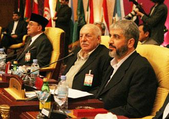 Damascus-based&nbsp;Hamas&nbsp;exile&nbsp;top&nbsp;leader&nbsp;Khaled&nbsp;Meshaal&nbsp;(R)&nbsp;attends&nbsp;an&nbsp;emergency&nbsp;Arab&nbsp;summit&nbsp;in&nbsp;Doha&nbsp;Jan.&nbsp;16,&nbsp;2009.&nbsp;Meshaal&nbsp;vowed&nbsp;on&nbsp;Friday&nbsp;that&nbsp;his&nbsp;movement&nbsp;would&nbsp;not&nbsp;accept&nbsp;Israel's&nbsp;conditions&nbsp;for&nbsp;a&nbsp;ceasefire&nbsp;in&nbsp;Gaza.(Xinhua/Li&nbsp;Zhen)