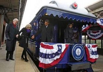 U.S. President-elect Barack Obama (2nd R), his wife Michelle (R), Vice President-elect Joe Biden (L) and his wife Jill board their train at a station in Wilmington, Delaware, January 17, 2009. They are on a train trip to Washington to kick off several days of inauguration festivities with Obama being sworn in as the 44th President of the United States on January 20.REUTERS/Jim Young (UNITED STATES)