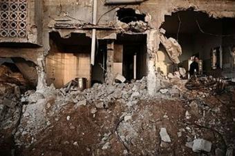 A Palestinian man looks for his belongings in the rubble of his house in Jabalia's Ezbet Abdrabbo neighborhood. Palestinians and Israelis are looking to Barack Obama to make peace in the Middle East his top foreign policy priority in the White House.(AFP/Olivier Laban-Mattei)