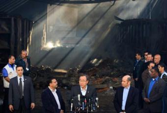 United Nations Secretary-General Ban Ki-moon (C) makes a speech during his visit to the damaged UN compound in Gaza City, Jan. 20, 2009. Ban Ki-moon on Tuesday visited the UN offices seriously damaged in recent Israeli military attacks on the Gaza Strip, saying the cycle of violence in the territory must end. Ban Ki-moon also called on Israel and Hamas to show restraint and observe their cease-fire.(Xinhua/Wissam Nassar)