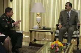 Pakistan's Prime Minister Yousaf Raza Gilani (R) meets with U.S. Central Command chief General David Petraeus at the Prime Minister House in Islamabad January 20, 2009. REUTERS/Faisal Mahmood