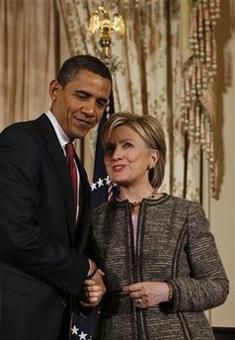 President Barack Obama shakes hands with Secretary of State Hillary Rodham Clinton at the State Department in Washington, Thursday, Jan. 22, 2009. (AP Photo/Charles Dharapak)