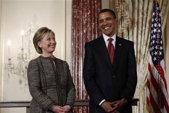 President Barack Obama and Secretary of State Hillary Rodham Clinton stand together at the State Department in Washington, Thursday,Jan.22,2009.(AP Photo/Charles Dharapak)