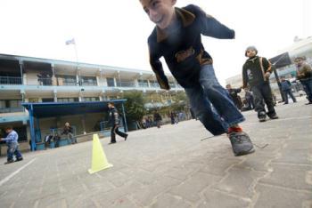 Gaza children have physical exercise class in the Beit Loliya Boys Elementary School in Gaza city Jan. 24, 2009. Some 200,000 Gaza children returned to school for the first time since Israel‘s offensive. (Xinhua/Zhang Ning)