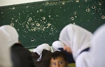 Palestinian&nbsp;students&nbsp;study&nbsp;in&nbsp;a&nbsp;classroom&nbsp;damaged&nbsp;in&nbsp;an&nbsp;Israeli&nbsp;army&nbsp;strike&nbsp;earlier&nbsp;this&nbsp;month,&nbsp;in&nbsp;Bureij&nbsp;camp&nbsp;in&nbsp;the&nbsp;central&nbsp;Gaza&nbsp;Strip,&nbsp;Thursday&nbsp;Jan.&nbsp;29,&nbsp;2009.&nbsp;