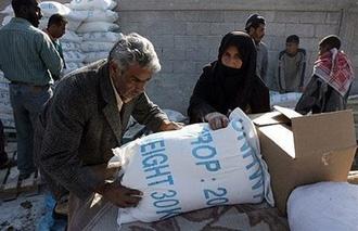 A&nbsp;Palestinian&nbsp;man&nbsp;carries&nbsp;a&nbsp;bag&nbsp;of&nbsp;food&nbsp;aid&nbsp;from&nbsp;the&nbsp;United&nbsp;Nations&nbsp;Relief&nbsp;and&nbsp;Works&nbsp;Agency&nbsp;(UNRWA)&nbsp;at&nbsp;the&nbsp;refugee&nbsp;camp&nbsp;of&nbsp;Rafah,&nbsp;January&nbsp;2008.(AFP/File/Said&nbsp;Khatib)
