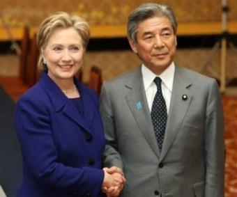 US Secretary of State Hillary Clinton (L) shakes hands with Japan's Foreign Minister Hirofumi Nakasone prior to their meeting in Tokyo. Clinton sought to reassure Japan Tuesday by backing it on North Korea and saying President Barack Obama will receive Prime Minister Taro Aso before any other foreign leader.(AFP/POOL/Tomohiro Ohsumi)