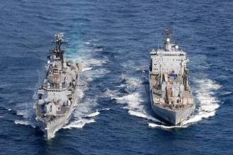 This picture released by the NATO shows the German oiler FGS Roehn (R) replenishing at sea the Italian Destroyer ITS Durand de la Penne, part of the anti-piracy operation in 2008.(AFP/NATO/File/Po Luigi Cotrufo)