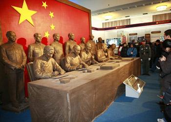 People visit the exhibition "Democratic Reform in the Tibet Autonomous Region" in Beijing, China, Feb. 25, 2009.(Xinhuanet Photo)