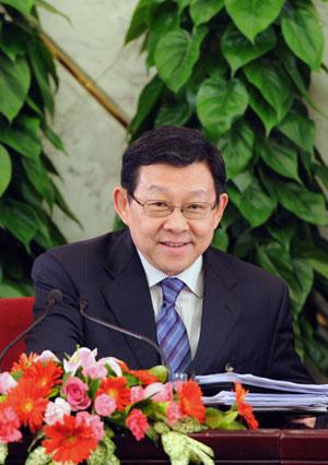 Minister of Commerce Chen Deming attends a press conference on 
