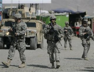 U.S. soldier patrol near the site of an explosion in the outskirts of Kabul, Afghanistan, Sunday, March 15, 2009.(AP Photo/Rafiq Maqbool)